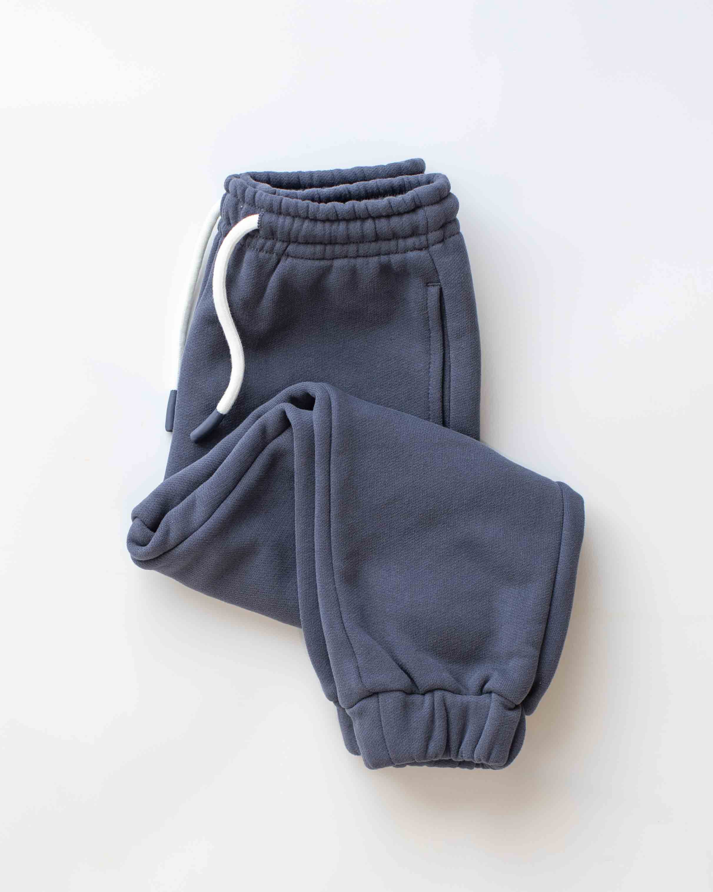 Pair of blue sweatpants on a white background